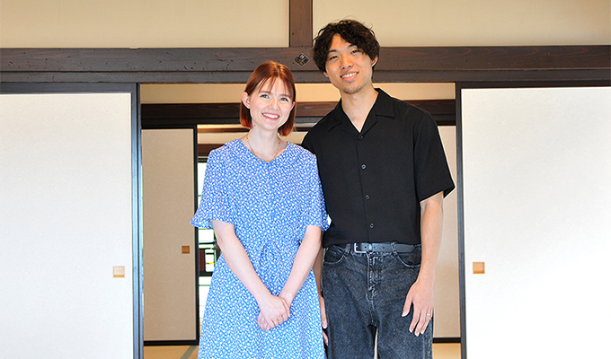 Right: Gentoku-san, Left: Amandine-san standing side by side in a room looking straight ahead